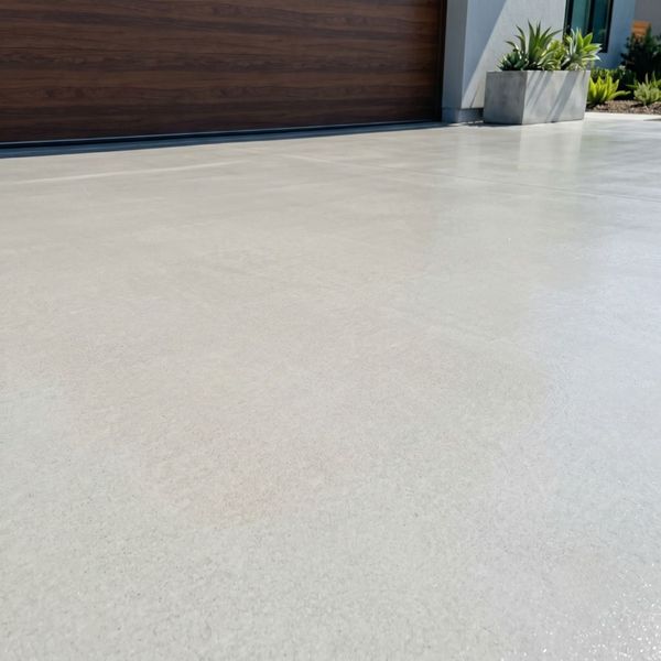 Clean and stain-free sealed concrete floor showing a smooth and vibrant finish.