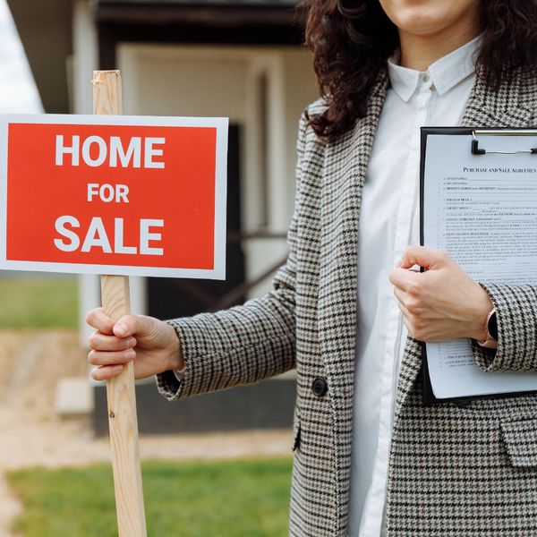 a for sale sign Understanding the Benefits of Sealing Your Residential Concrete (2).jpg