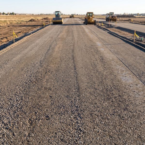 Evenly graded and compacted sub-base prepared with optimal slope and drainage contours.