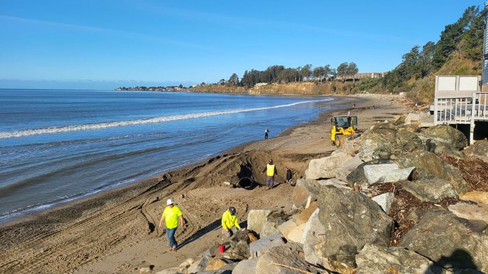 Durden Construction crew performing coastal site development and erosion control on a beach. Durden Construction crew performing coastal site development and erosion control on a beach.