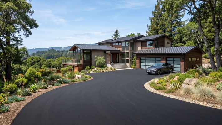 High-quality asphalt driveway installation for a residential home in Santa Cruz showing smooth, dark pavement.