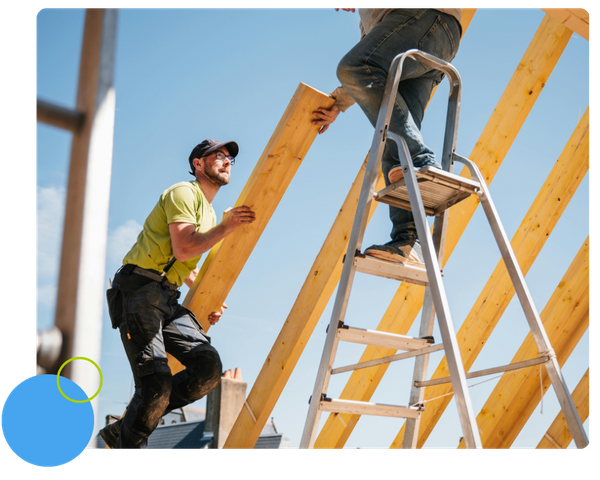 Two roofers at a job site. Two roofers at a job site.
