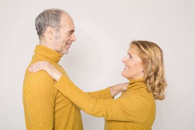 image of a couple wearing matching sweaters