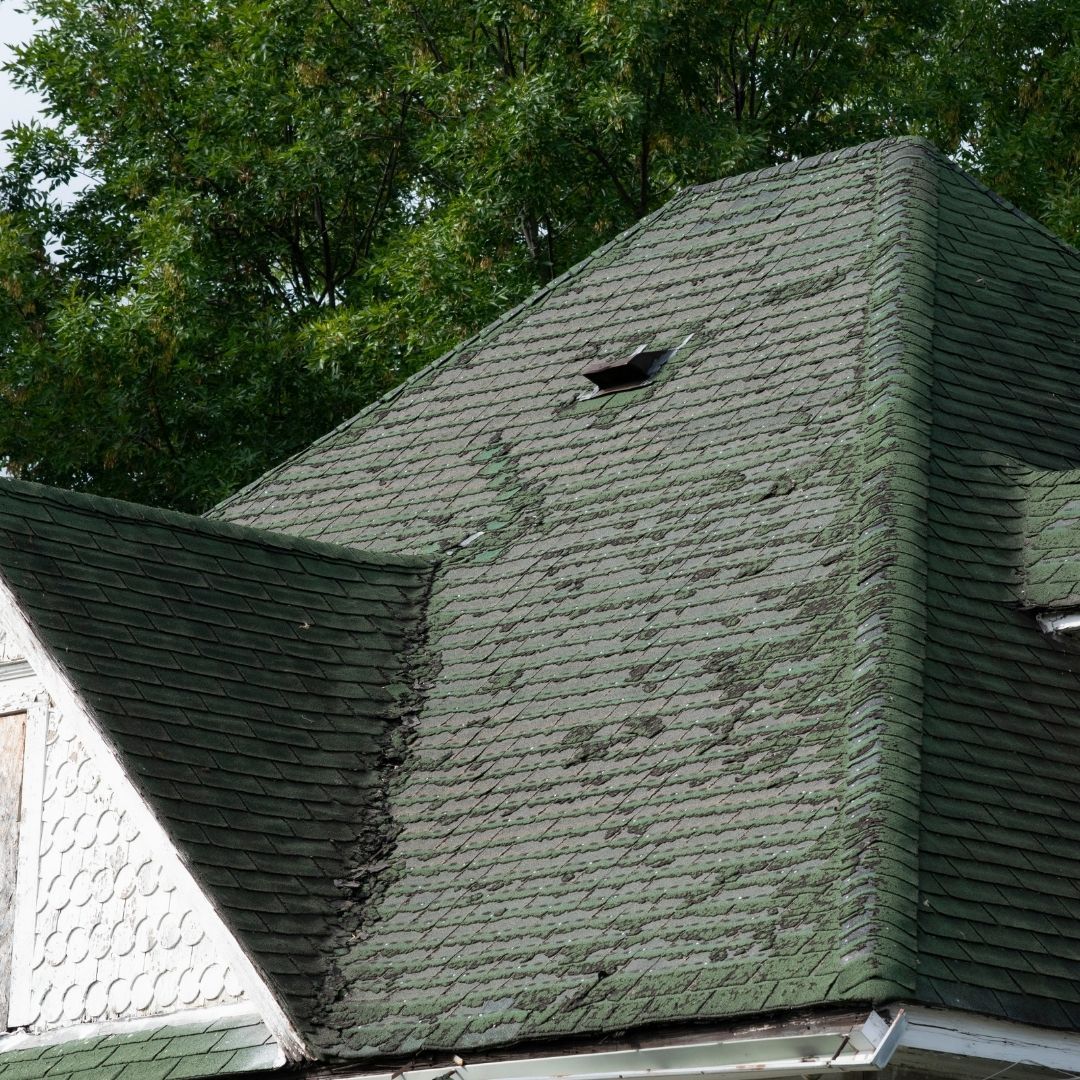 home with old and faded roof