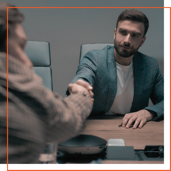 boss shaking hands with employee