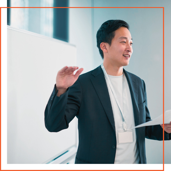 smiling boss speaking to staff