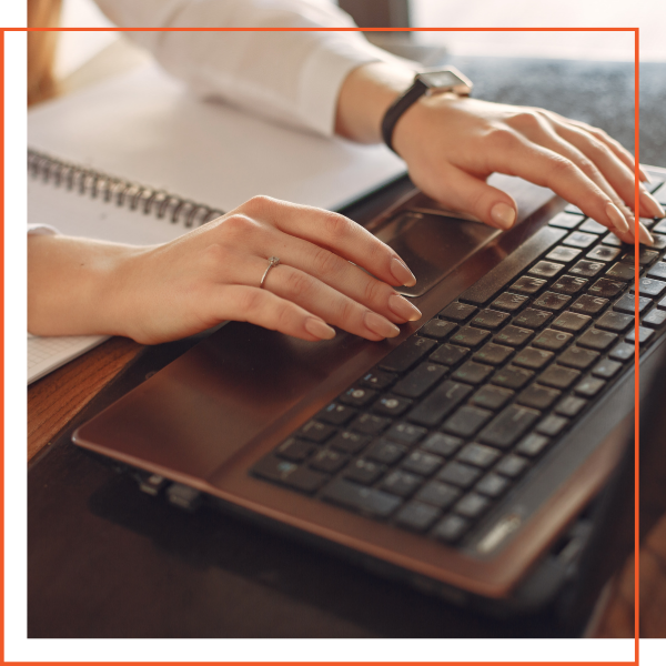 Woman typing on laptop keyboard Woman typing on laptop keyboard