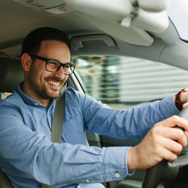 man driving car