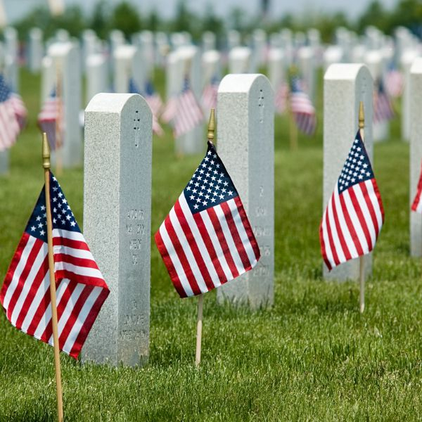 American flags next to tombstones