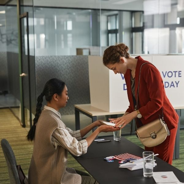 two young women at the polls 