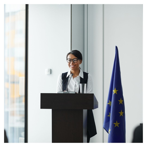 woman speaking at podium