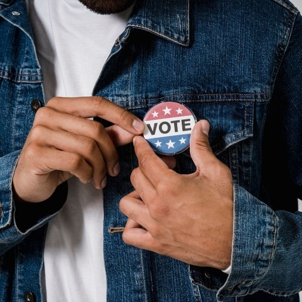 person with a voting pin