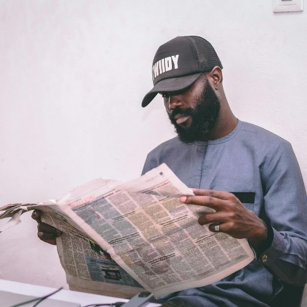 man reading newspaper 