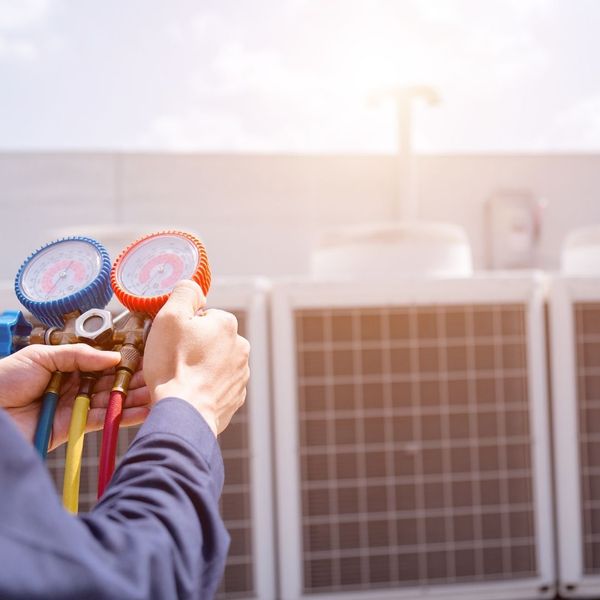 AC tech working on a commercial unit