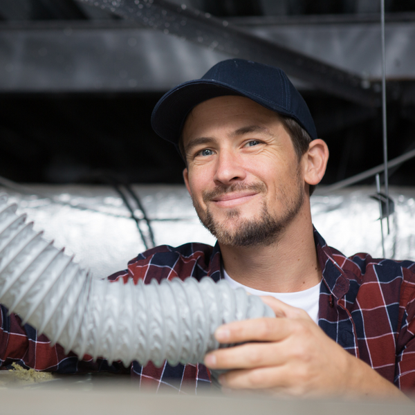 HVAC tech holding duct HVAC tech holding duct
