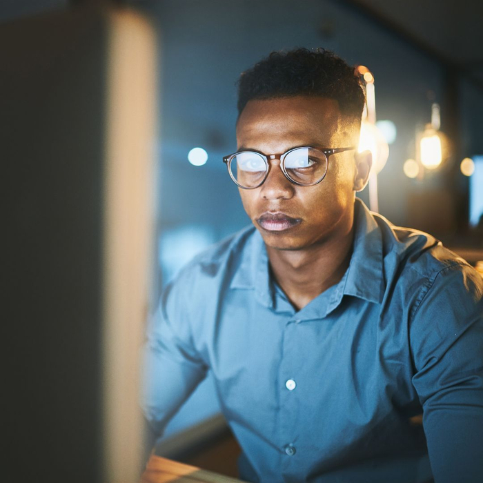 Guy focused on computer screen