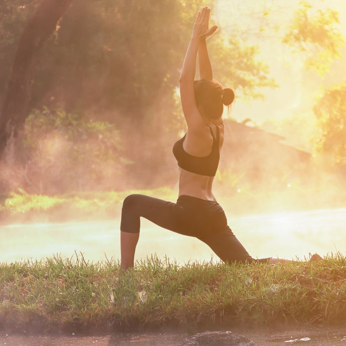 lady stretching in a field