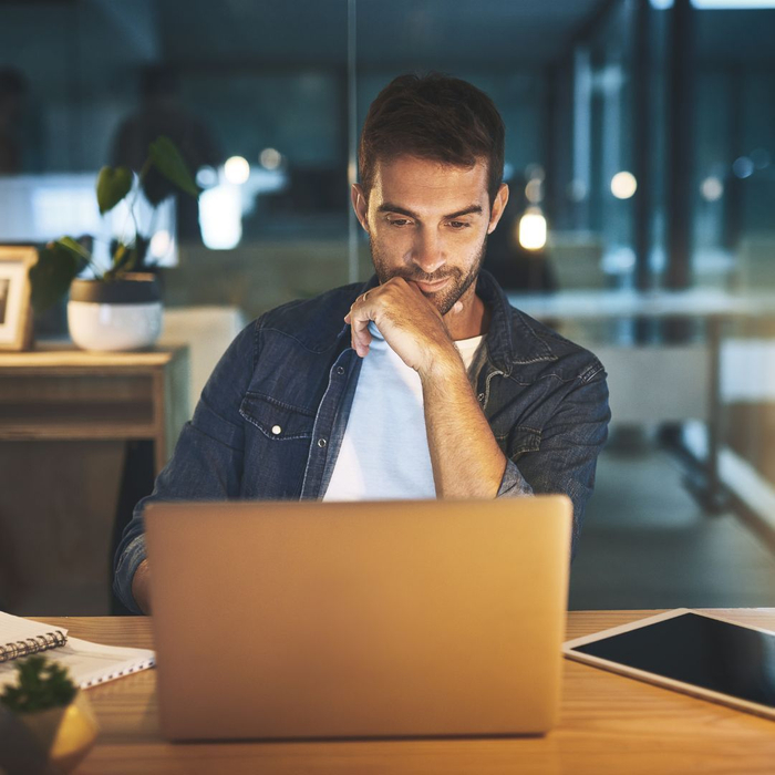 guy focusing on laptop