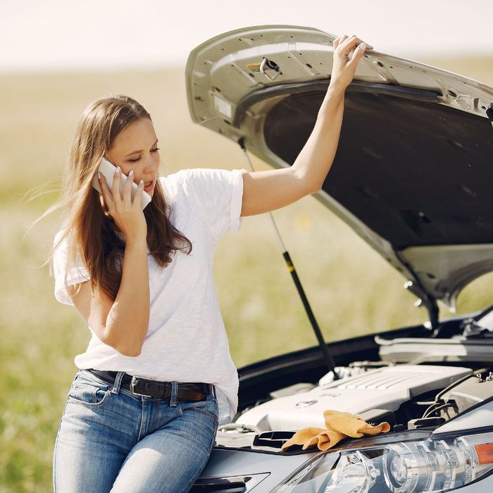 Person making a phone call on the side of the road