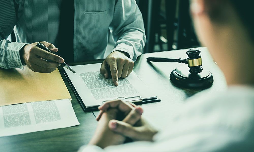 man discussing with lawyer