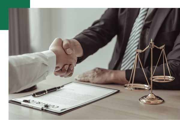 An attorney shaking hands with a client
