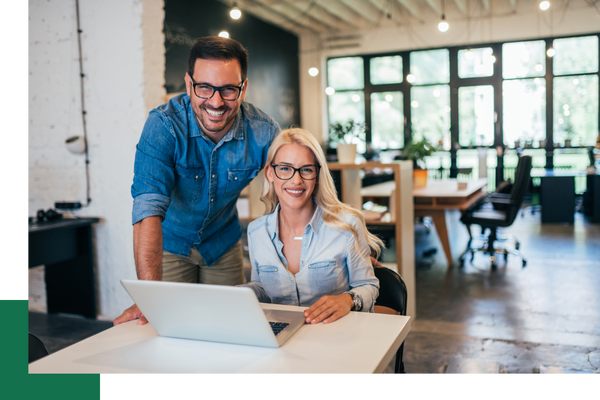 man and woman business owners smiling