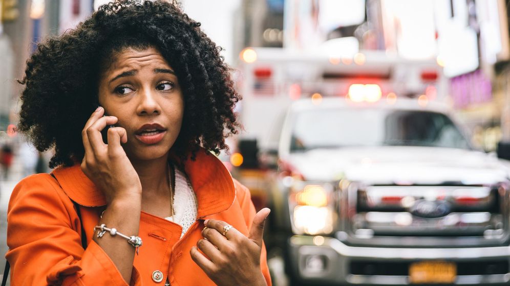 woman on phone after car accident