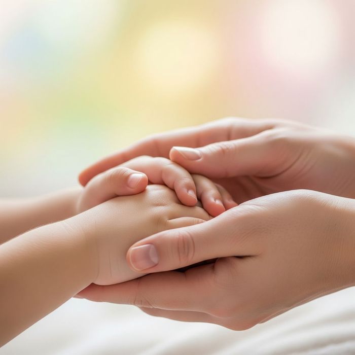 An adult's hands holding a child's hands, symbolizing the legal standard of the child's best interest. An adult's hands holding a child's hands, symbolizing the legal standard of the child's best interest.