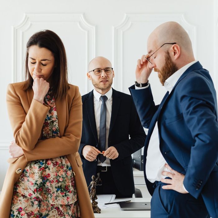 couple arguing in front of lawyer