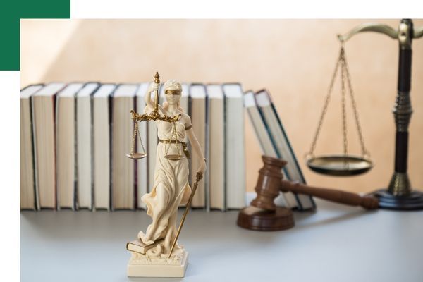 A white figure of lady justice