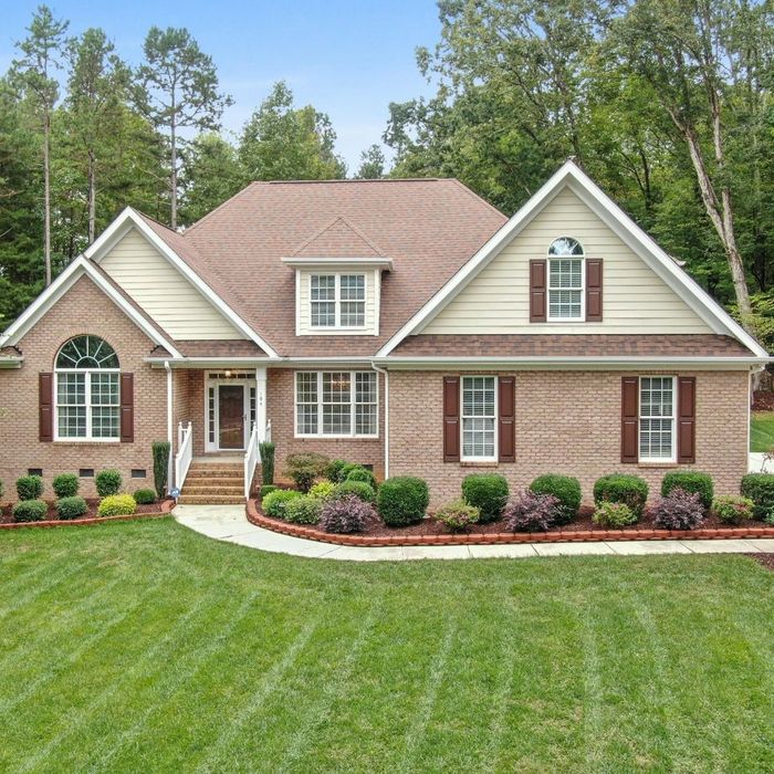 Brick House with Grass Lawn