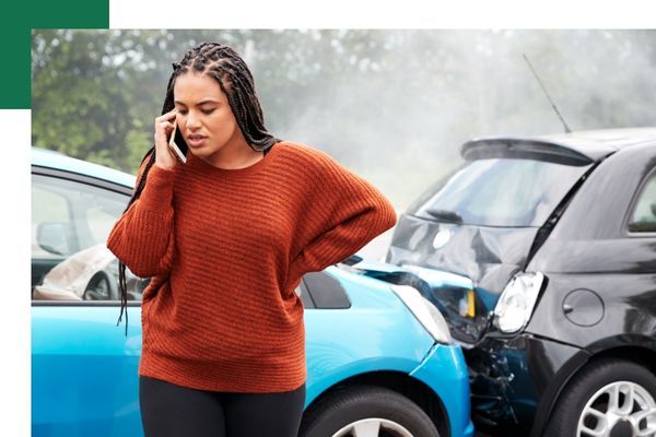 Women on the phone after a car crash
