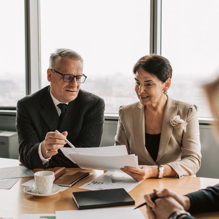 A Man and a Woman Looking at Papers
