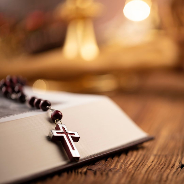 catholic rosary on a plaque