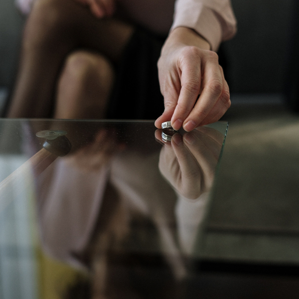 woman holding wedding ring