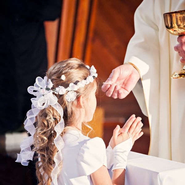 child taking Holy Communion