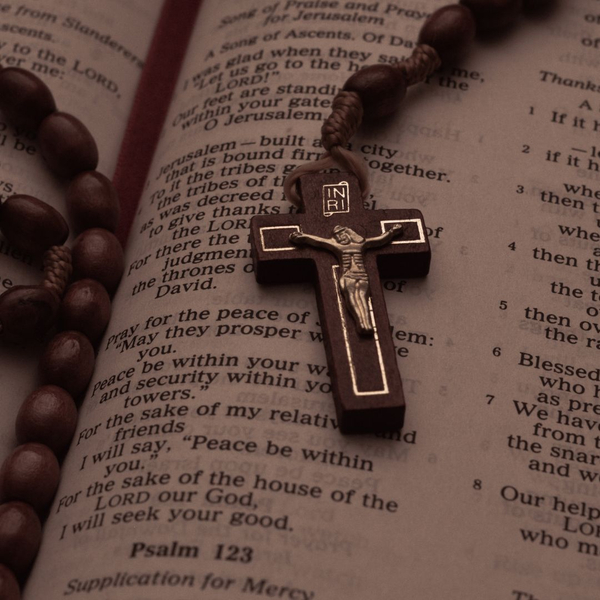 rosary on open bible