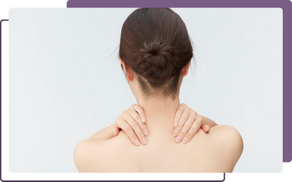 woman rubbing shoulders