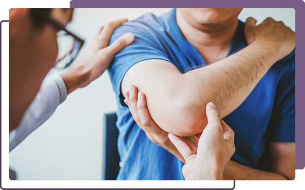 chiropractor treating elbow pain