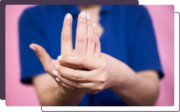 chiropractor demonstrating carpal tunnel with her hand