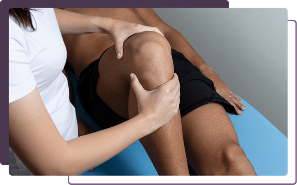 chiropractor looking at knee injury