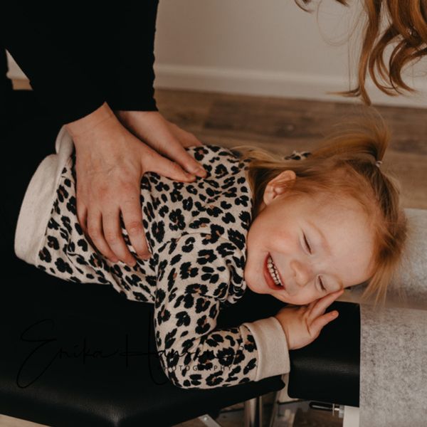 image of a toddler getting an adjustment