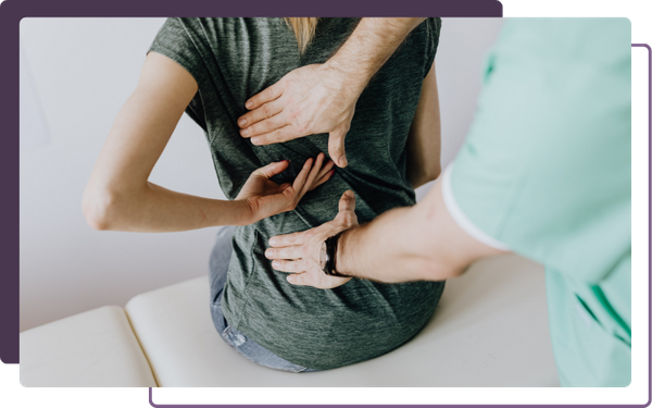 chiropractor adjusting back posture