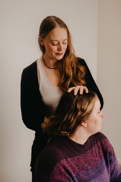 Dr. Annika Larson working with patient