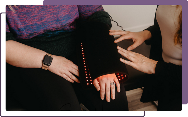 chiropractor treating wrist pain with light therapy
