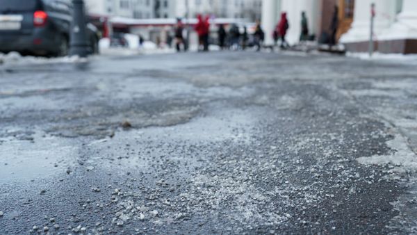 rock salt on sidewalk near businesses