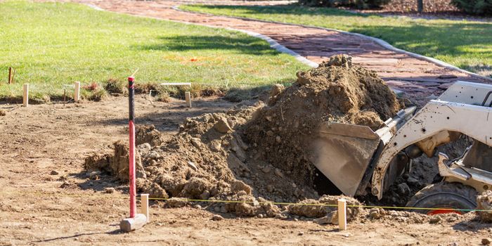 Digging up dirt in a yard