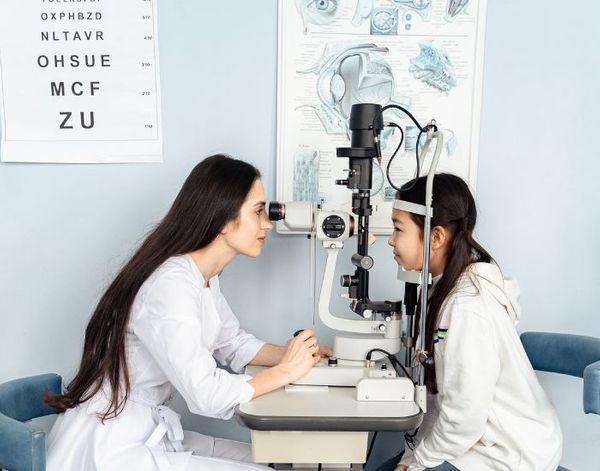 optometrist with kid patient