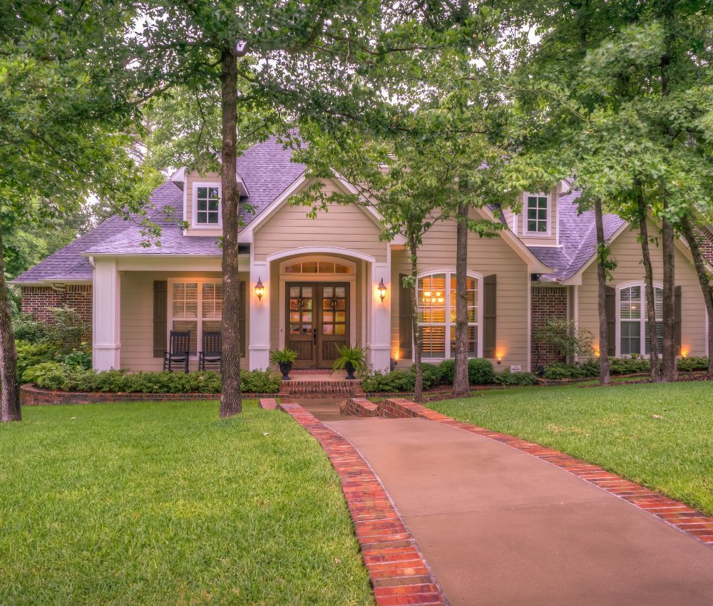 a new home surrounded by trees Marvin Custom Home Builders.jpg