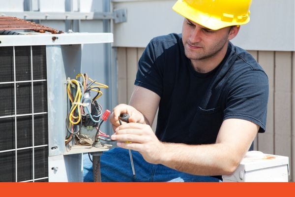 HVAC contractor working on unit repairs
